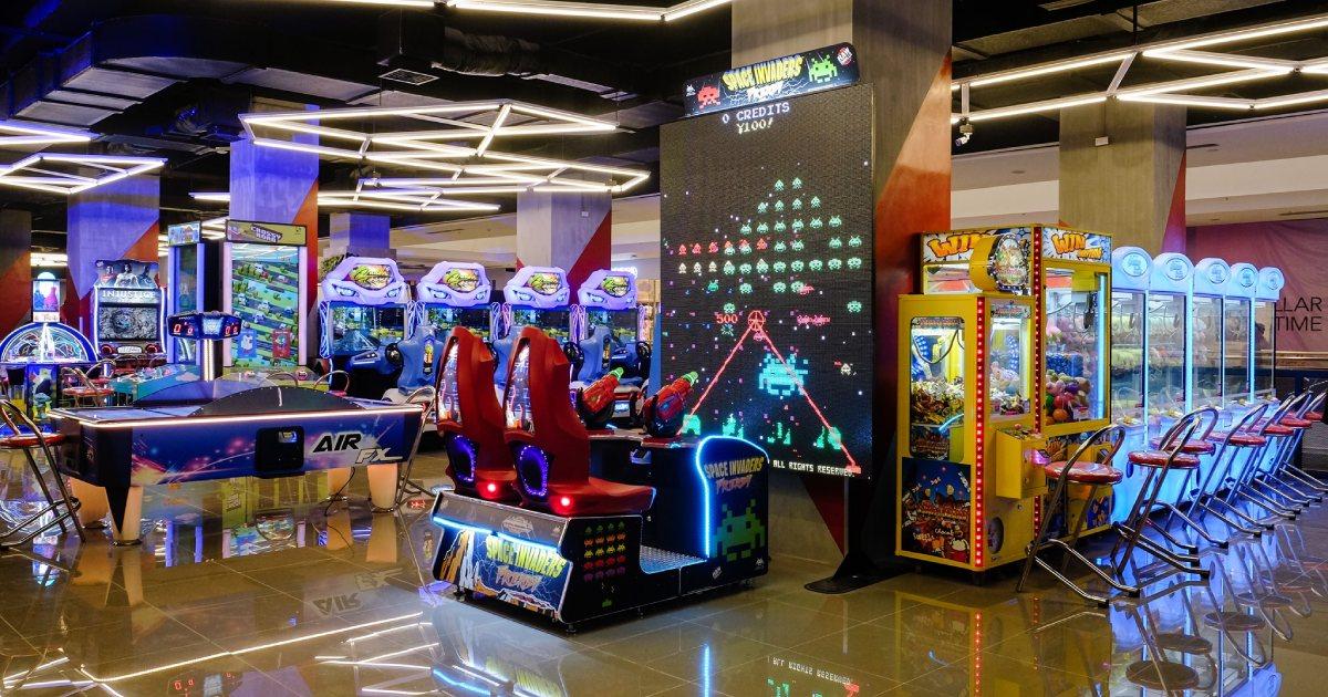 Arcade games and people playing inside Timezone BGC