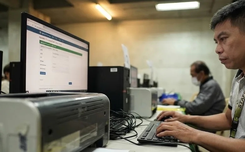 An employee working on tax payments.