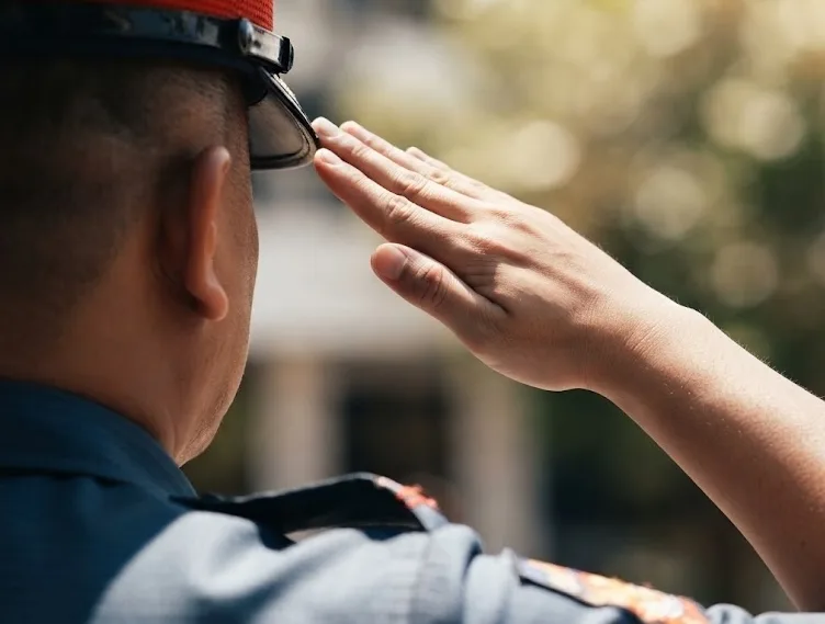 A police officer giving a salute.