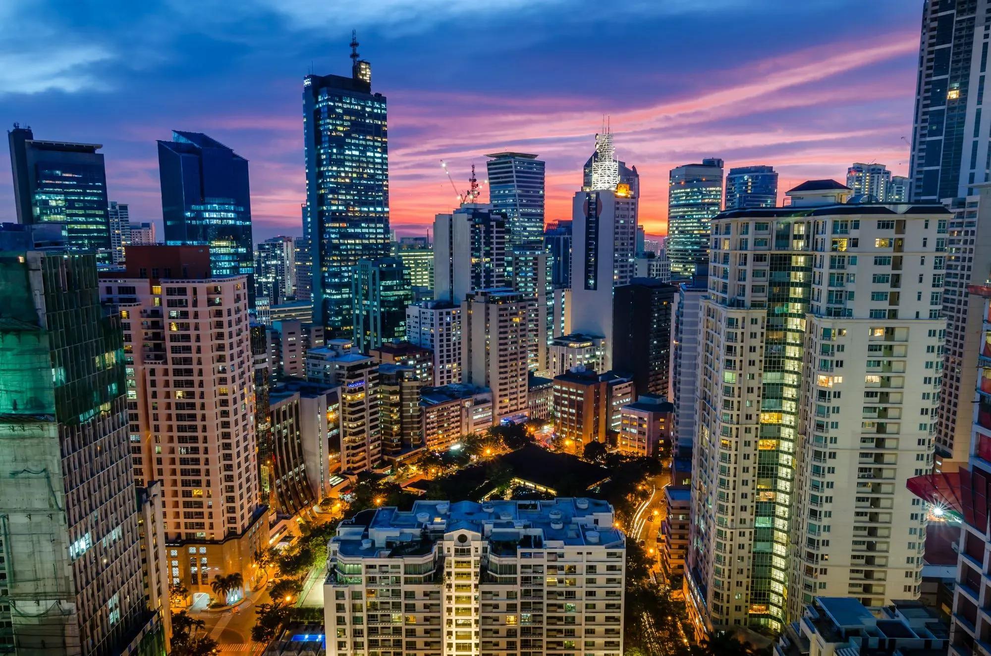 Tourists enjoying nightlife, rooftop parties, DJ performances, luxury clubs, and skyline entertainment experiences at The Palace Manila in Bonifacio Global City
