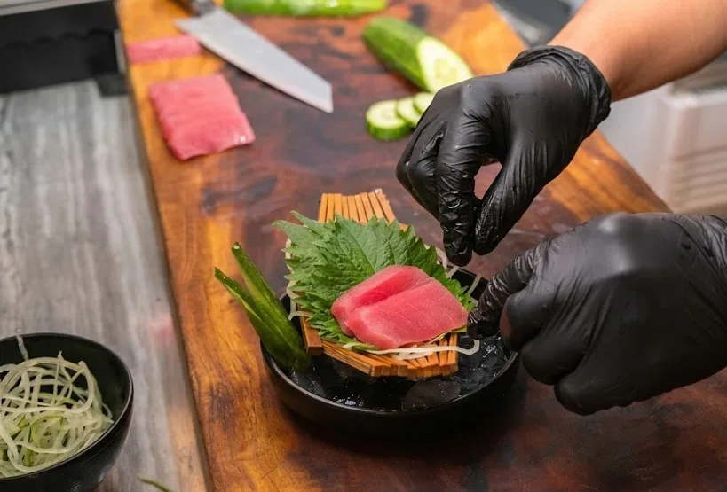 Tuna being prepared to look presentable to customers.