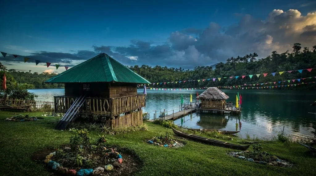 Lake Mahagnao's nestled by the water's edge, where tranquility meets the whispering breeze.
