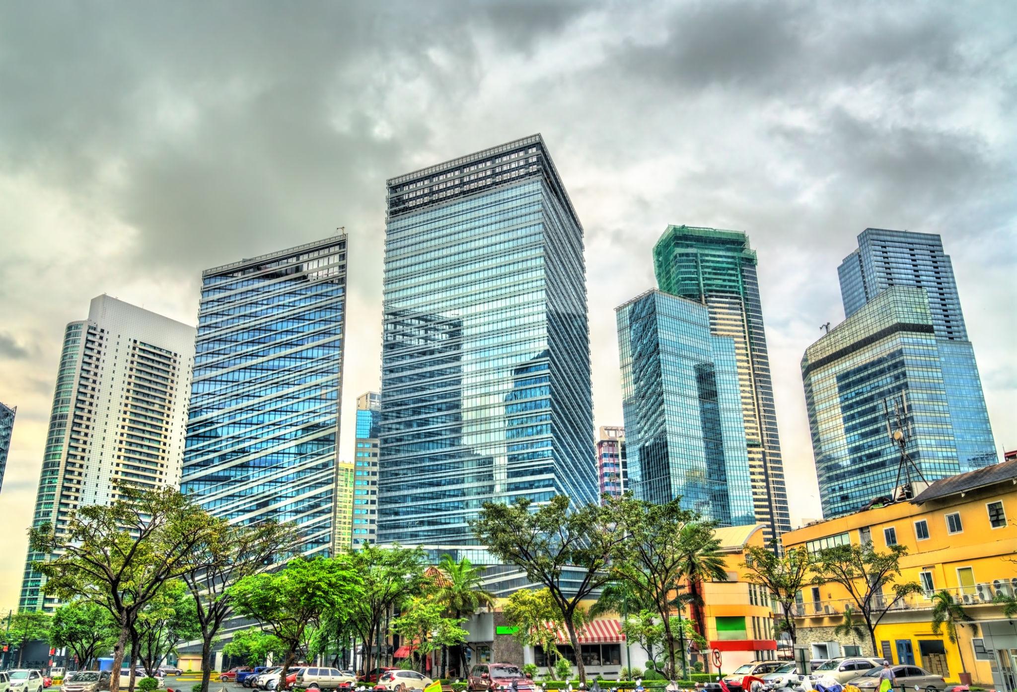 Modern glass building and business district view in BGC