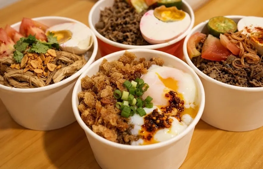 Rice bowls with different toppings at a night market.