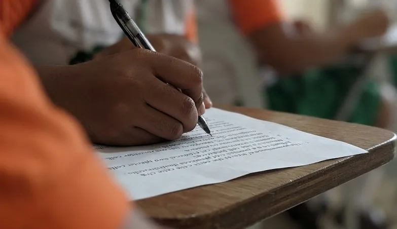 A student writing during an examination.